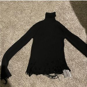 Turtle neck distressed swearer.